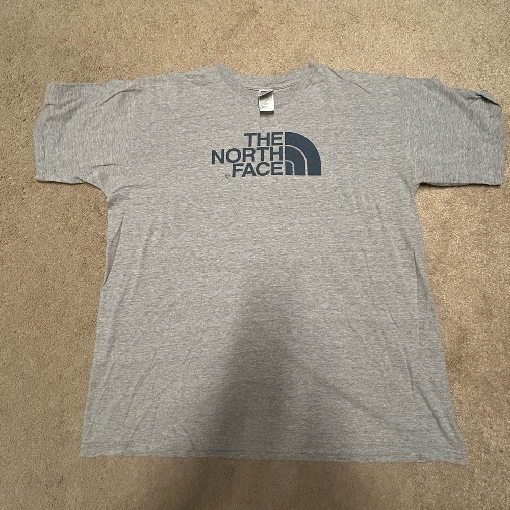 The North Face grey men’s XL T Shirt Blue logo and lettering